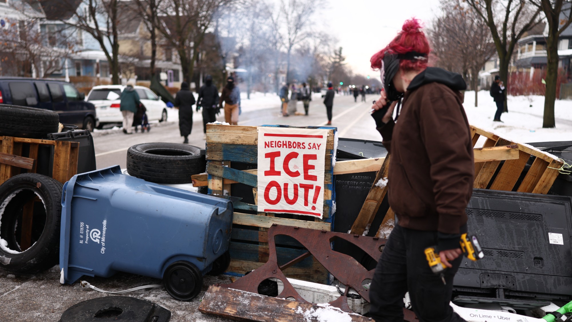 US-IMMIGRATION-ICE-SHOOTINGDemonstrators gather at the street where 37-year-old Renee Nicole Good was shot and killed at point blank range on January 7 by a US Immigration and Customs Enforcement (ICE) agent as she apparently tried to drive away from agents who were crowding around her car, in Minneapolis, Minnesota, on January 8, 2026. A US Immigration and Customs Enforcement (ICE) agent shot and killed an American woman on the streets of Minneapolis January 7, leading to huge protests and outrage from local leaders who rejected White House claims she was a domestic terrorist. The woman, identified in local media as 37-year-old Renee Nicole Good, was hit at point blank range as she apparently tried to drive away from agents who were crowding around her car, which they said was blocking their way. (Photo by CHARLY TRIBALLEAU / AFP via Getty Images)