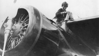 Aviator Amelia Earhart in the cockpit of her aeroplane at Culmore, near Derry, Ireland, after her solo Atlantic flight.