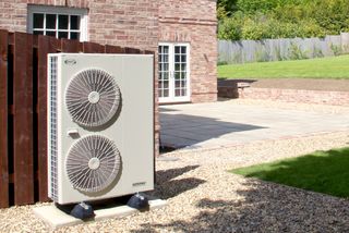 an air source heat pump outside of a house