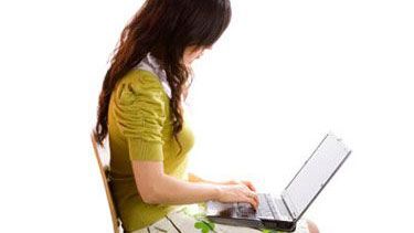 Girl sat on laptop