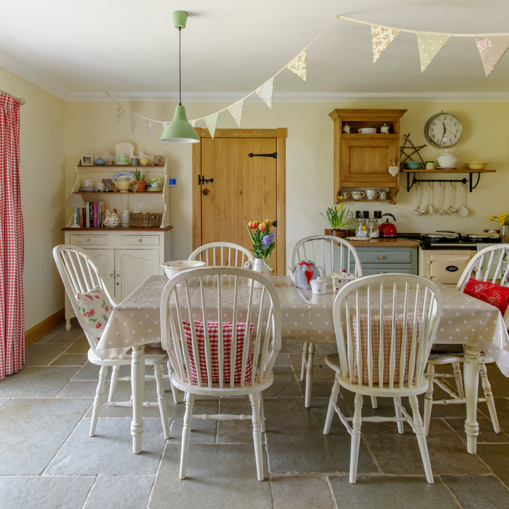 dining area with dining table and white chair