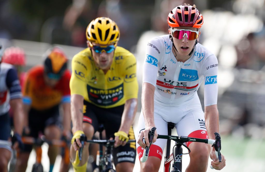 Team UAE Emirates rider Slovenias Tadej Pogacar wearing the best youngs white jersey and Team Jumbo rider Slovenias Primoz Roglic wearing the overall leaders yellow jersey cross the finish line at the end of the 16th stage of the 107th edition of the Tour de France cycling race 164 km between La Tour du Pin and VillarddeLans on September 15 2020 Photo by Sebastien Nogier AFP Photo by SEBASTIEN NOGIERAFP via Getty Images