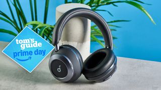 Soundcore Space One Pro headphones on a stone surface with a Tom's Guide Prime Day deal badge on the left side of the image.