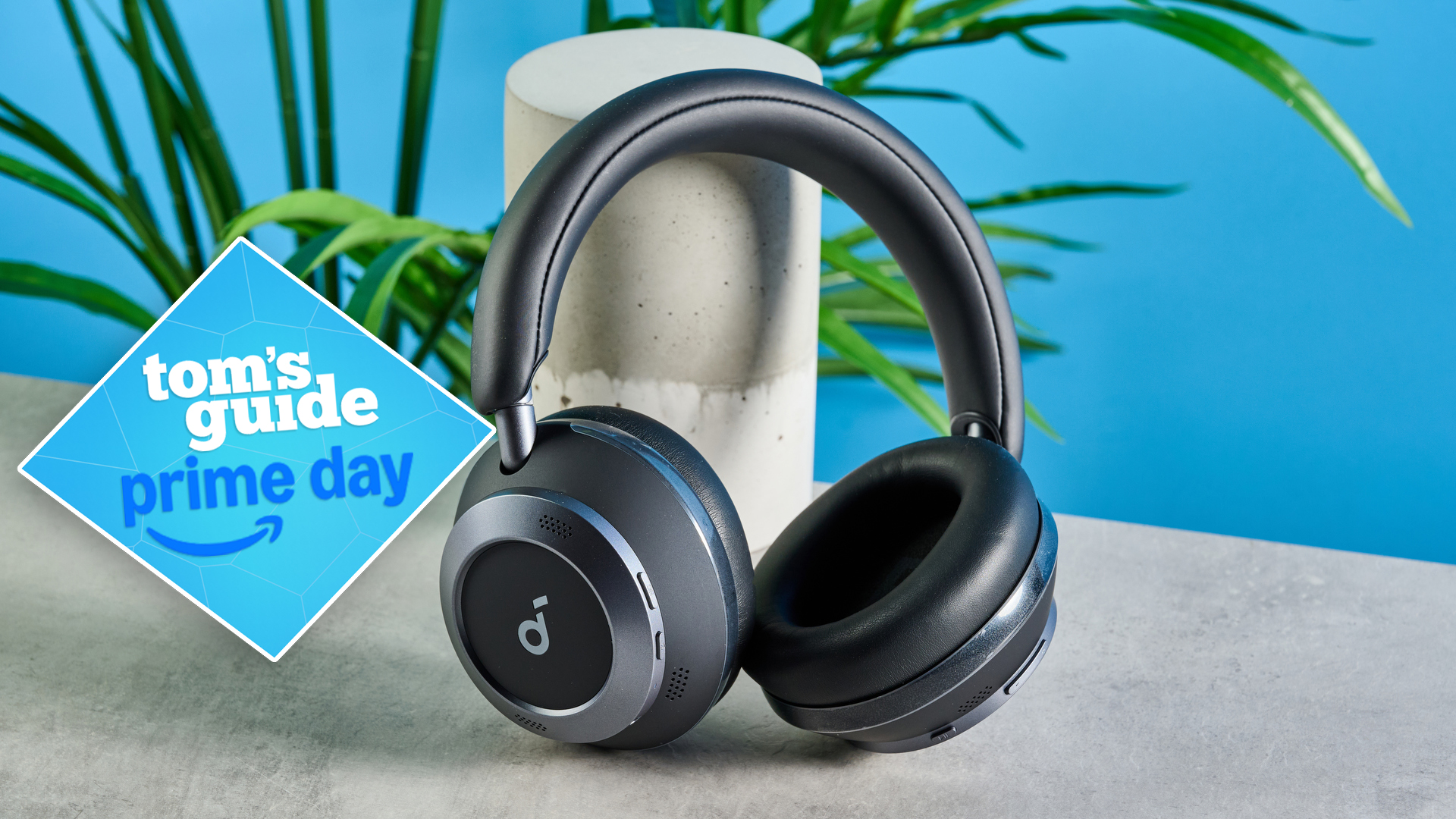 Soundcore Space One Pro headphones on a stone surface with a Tom&#039;s Guide Prime Day deal badge on the left side of the image.