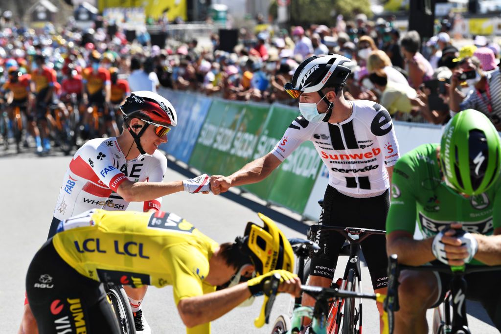 Stage 9 protagonists Marc Hirschi (Sunweb, right) – who spent most of the day solo in a breakaway – and eventual stage winner Tadej Pogacar (UAE Team Emirates, left) greet each other ahead of stage 10 of the 2020 Tour de France