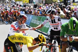 Stage 9 protagonists Marc Hirschi (Sunweb, right) – who spent most of the day solo in a breakaway – and eventual stage winner Tadej Pogacar (UAE Team Emirates, left) greet each other ahead of stage 10 of the 2020 Tour de France