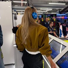 Rosie Huntington-Whiteley wearing a satin Helsa bomber jacket at the F1 Qatar Grand Prix