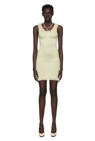 ssense model wearing cream ribbed dress