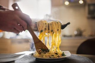 Cancer care: adult serves pasta