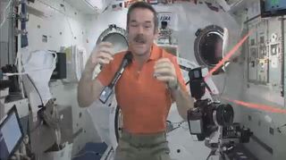 Commander Hadfield With Floating Microphone and Camera