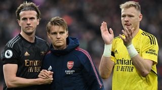 Rob Holding, Martin Odegaard and Aaron Ramsdale of Arsenal acknowledge the fans at full-time of the Premier League match between Liverpool and Arsenal at Anfield on April 8, 2023 in Liverpool, United Kingdom.