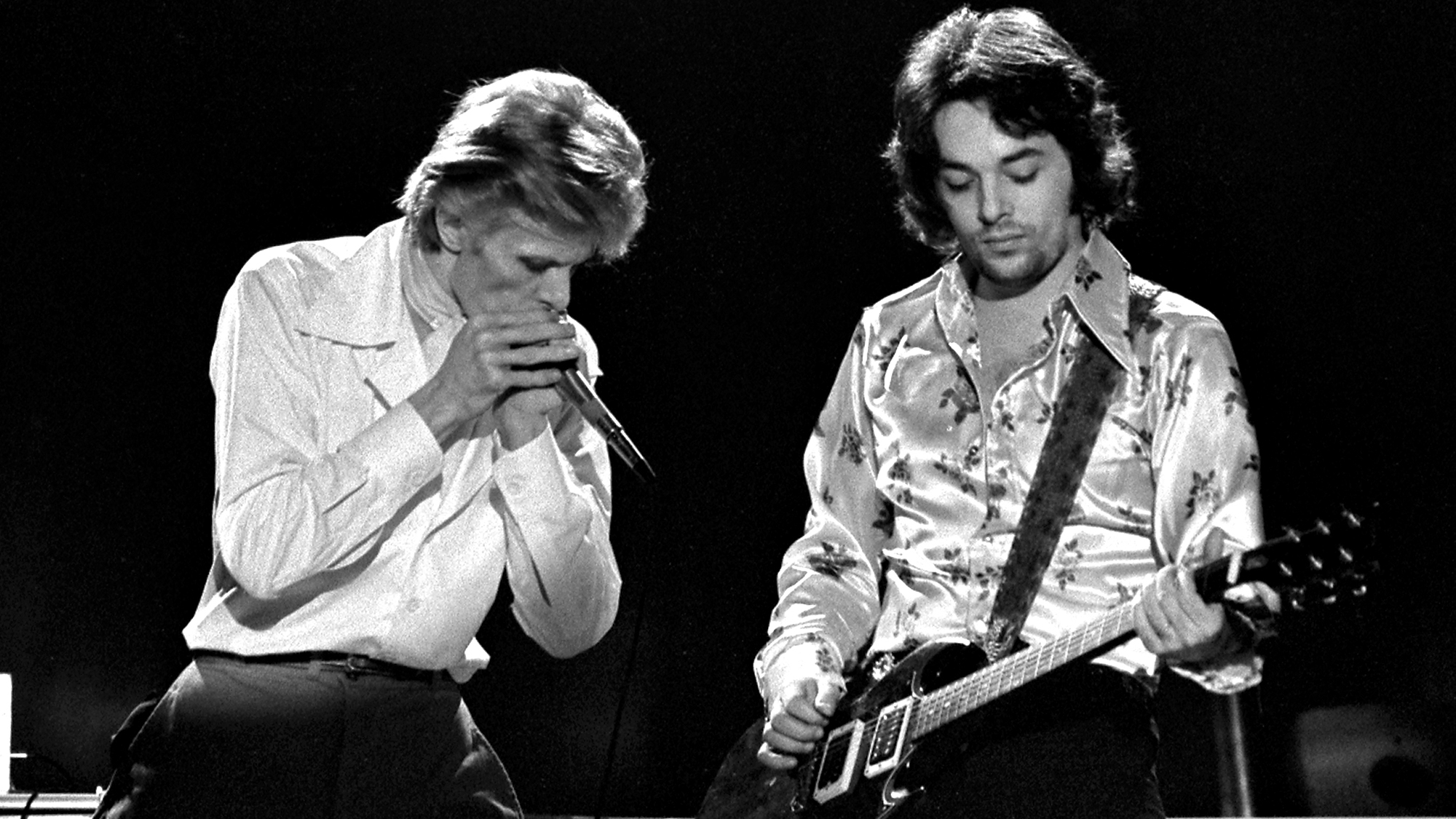 David Bowie and Earl Slick performing on David Bowies' Diamond Dogs Tour at the Boston Music Hall on November 15, 1974