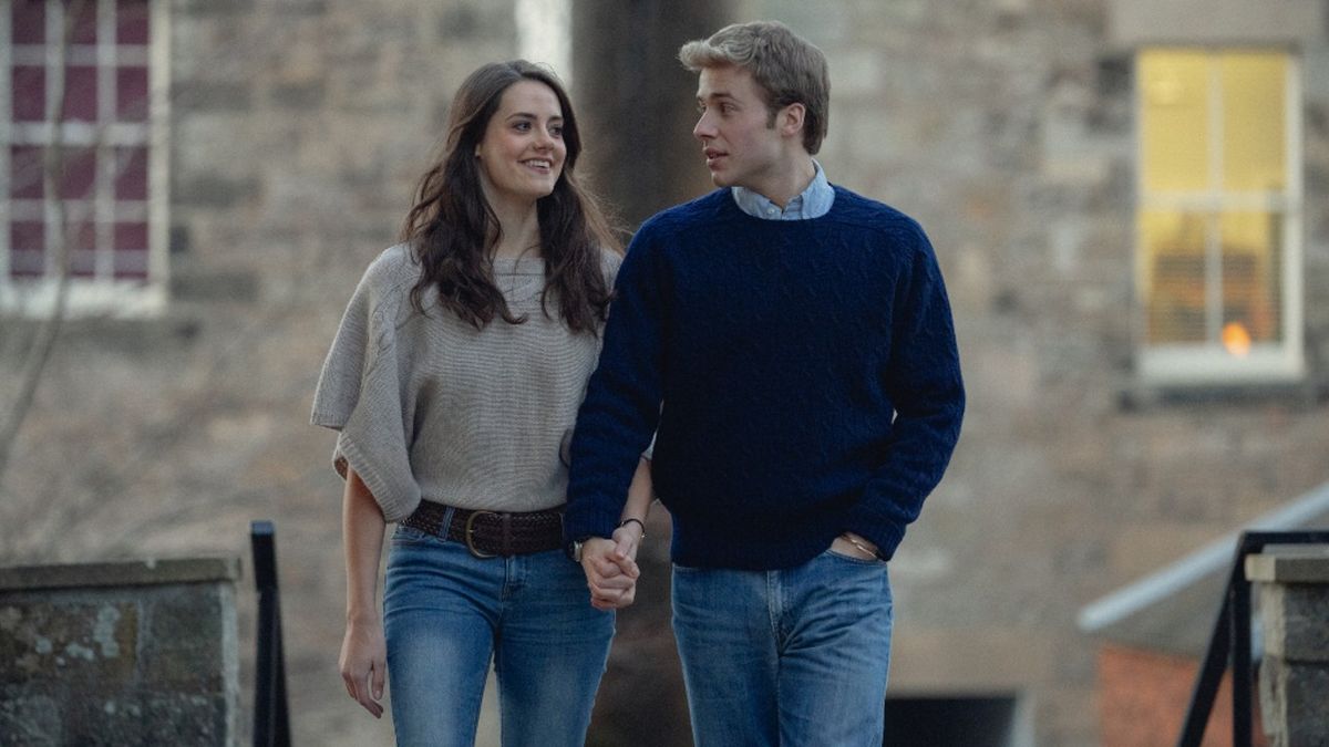 Meg Bellamy and Ed McVey as Kate Middleton and Prince William walking hand in hand in Season 6 of the Crown.