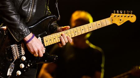 Musician Kenny Wayne Shepherd, guitar detail of David Gilmour's 'Black Strat which was used to record the Pink Floyd album 'Wish You Were Here,' performs onstage during the Jim Irsay Collection Exhibit and Concert at Shrine Auditorium and Expo Hall on January 11, 2024 in Los Angeles, California