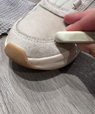 A white eraser on neutral sneakers