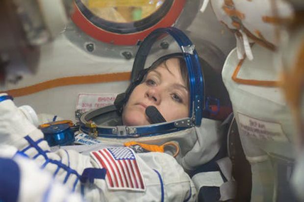 Anne McClain of NASA runs through procedures in the Soyuz MS-11 spacecraft during a vehicle fit check Nov. 20.