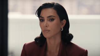 Kim Kardashian in a red blazer in All's Fair 