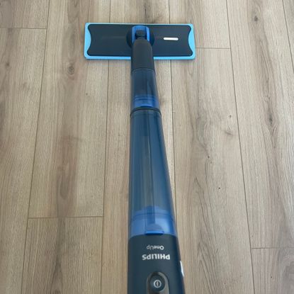 Philips OneUp 5000 Series Electric Mop on wood-effect flooring