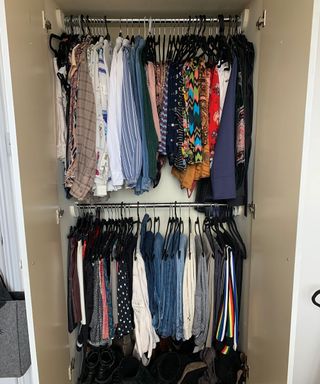 Clothes hung up in wardrobe