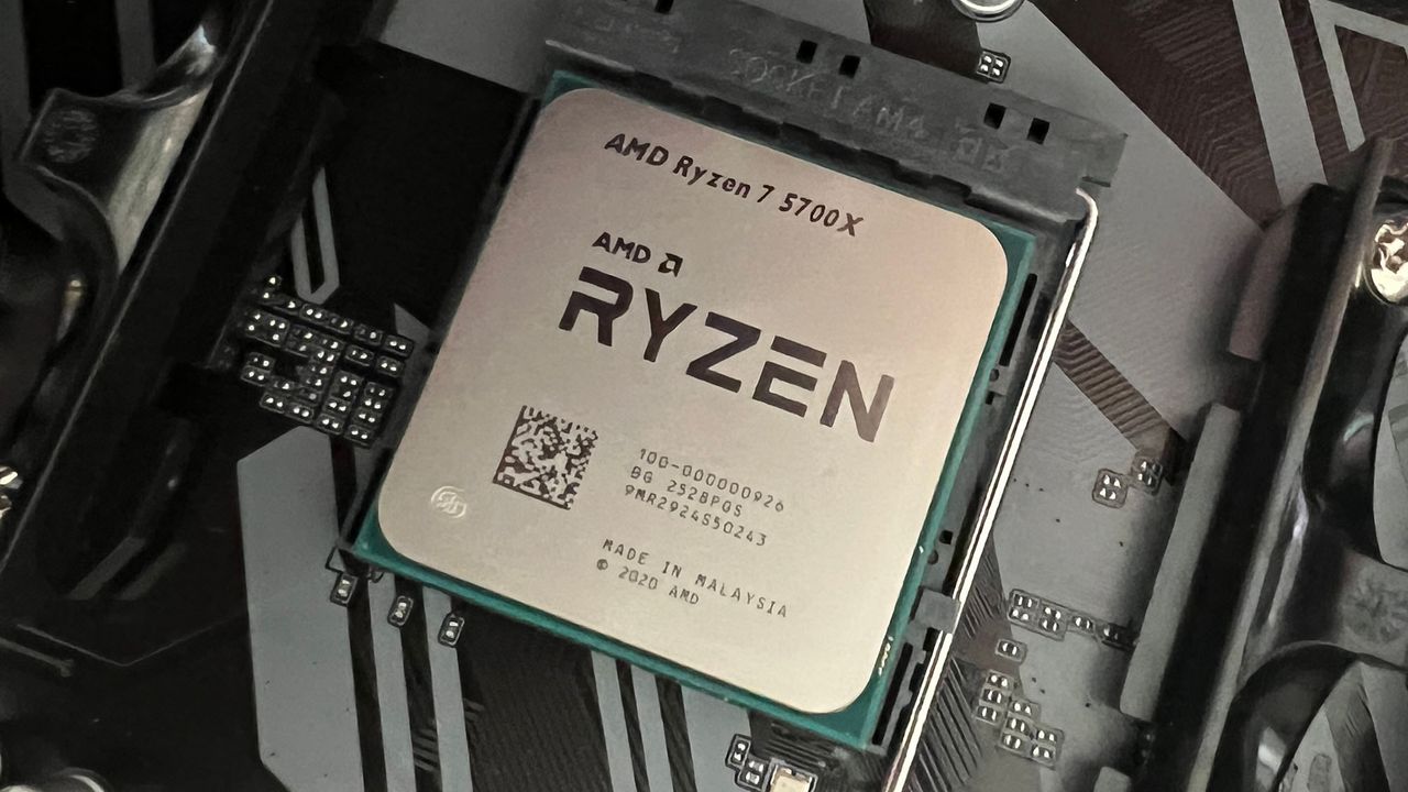 An AMD Ryzen 7 5700X slotted into a motherboard socket