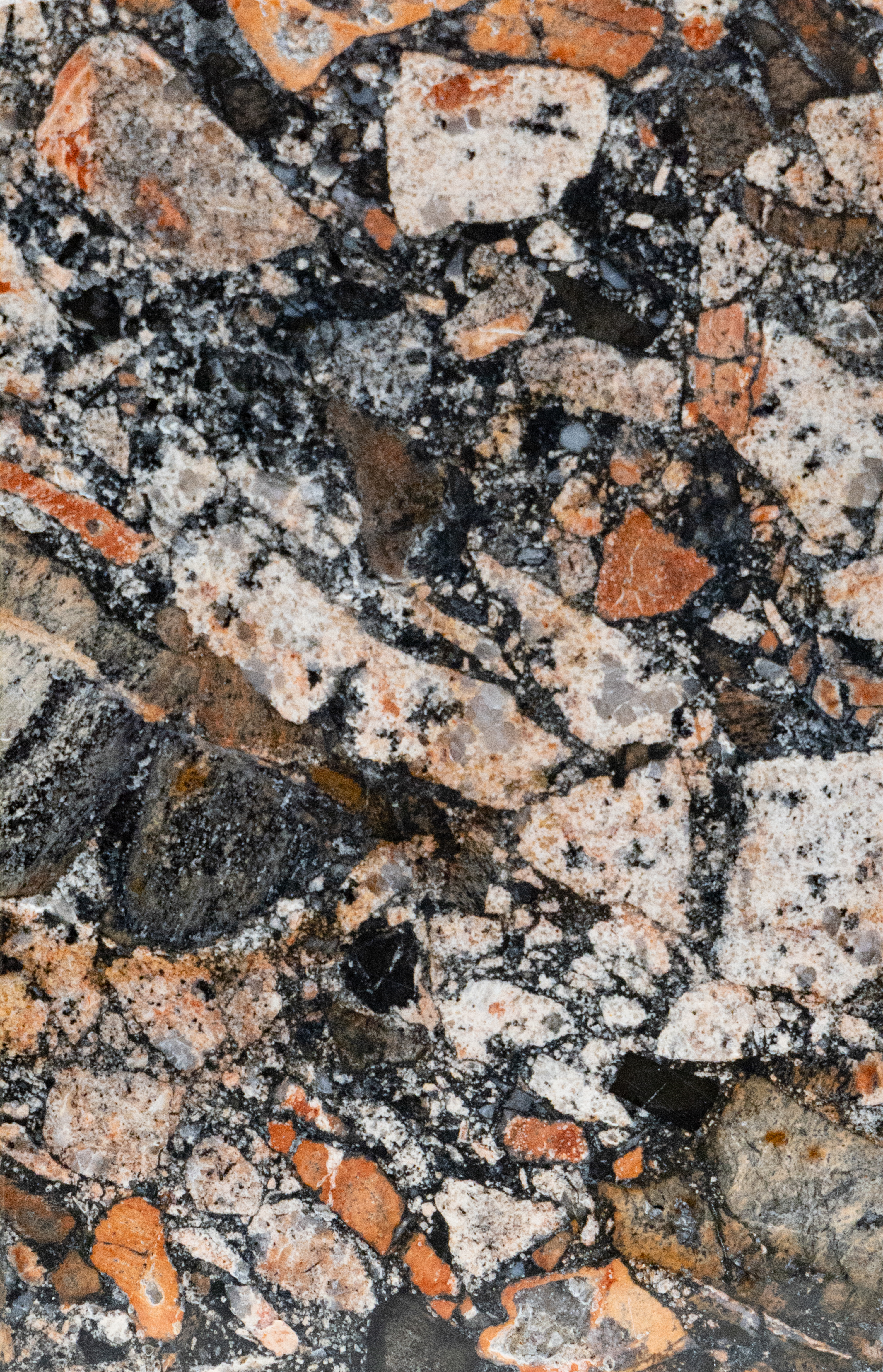 Red, white, and black stone is maixed together to create Cloam English Anglomerate