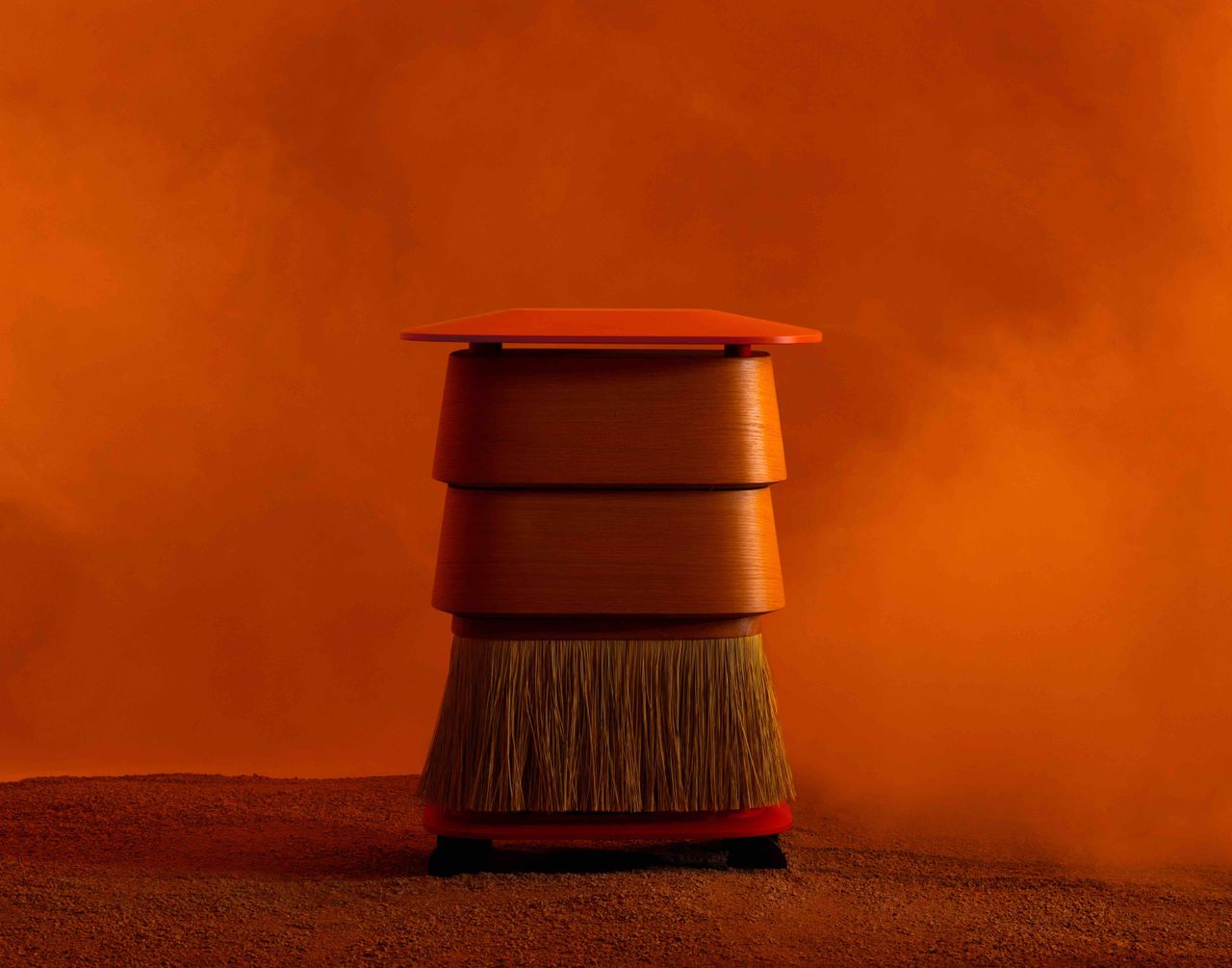 furniture, clothing and accessories on orange backdrop