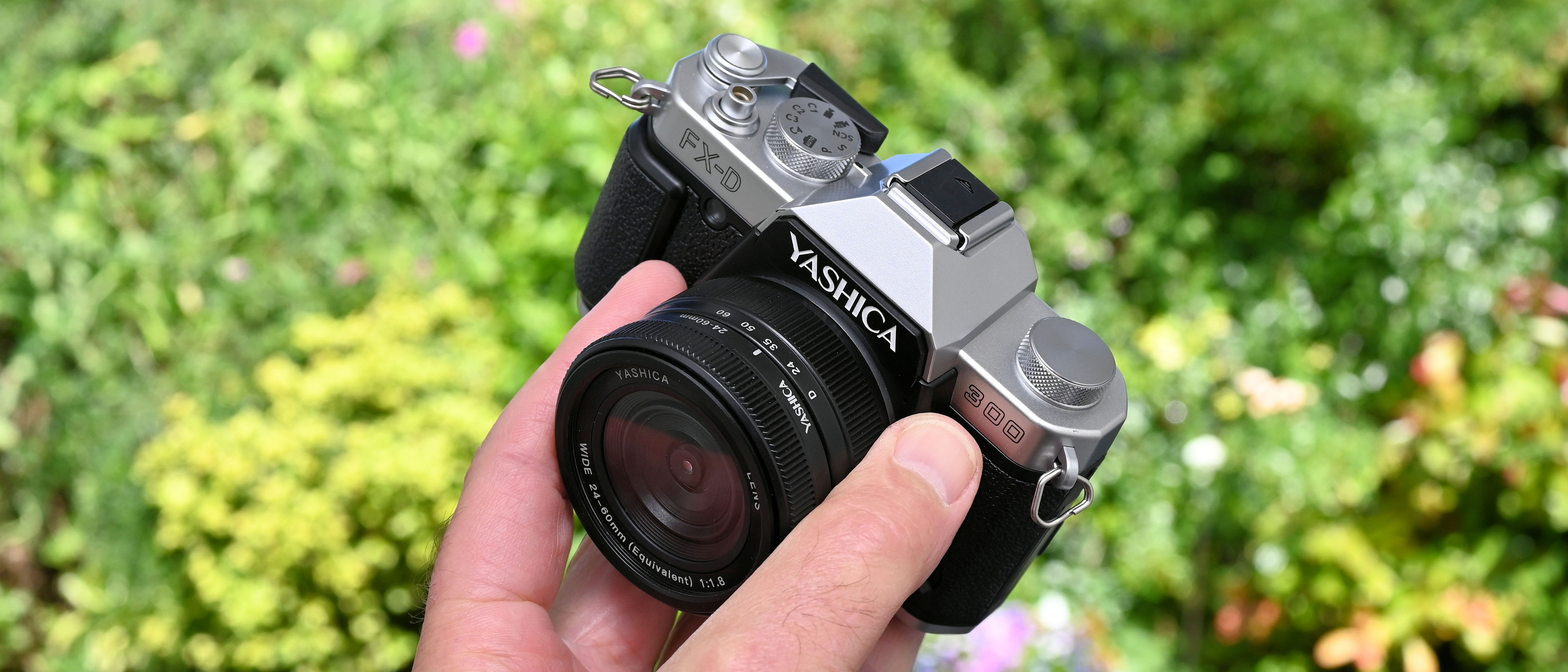 Yashica FX-D 300 product shot, camera held in hand