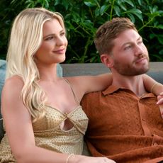 libby and andrew sit with their arms around each other on netflix's age of attraction